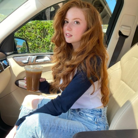 Francesca Capaldi in a lavish car.